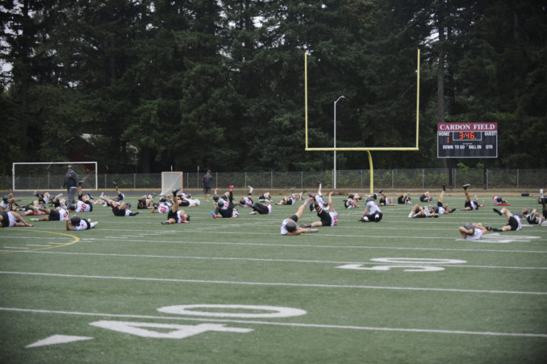 Camas football players work out during the first practice of the 2019-20 season at Cardon Field in Camas on Tuesday, Aug.