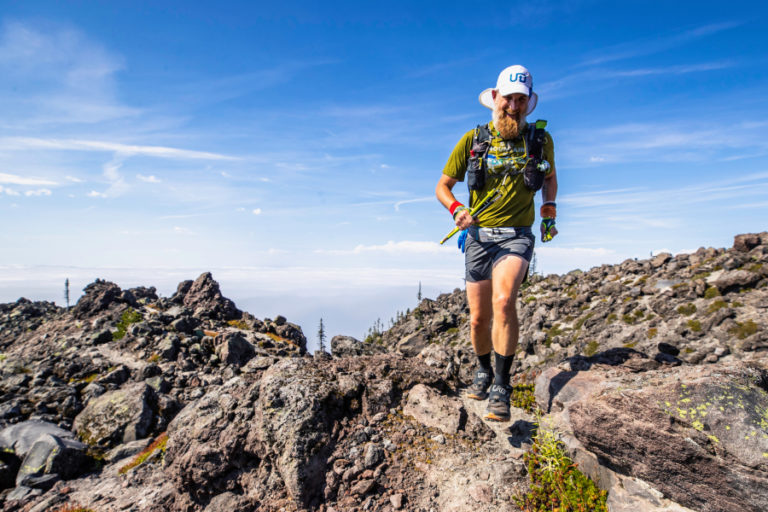 Dave Stinchfield runs in a boulder field near Mount St.