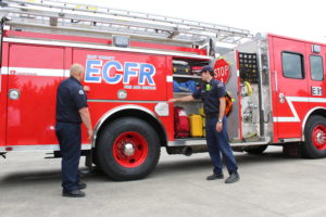 East County Fire and Rescue Fire Captain James Troutman (left) and part-time firefighter-EMT Nollan Charles (right) show the inner contents of ECFR Station 91's $400,000 fire engine, purchased in 2018, with equipment reserves. The district needed a new engine, but had tight budget constraints, so did not go for one with 