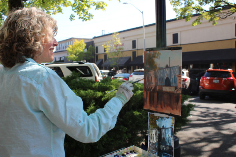 Artist Cheryl Mathieson paints scenes of downtown Camas during the 2018 Plein Air event, which has artists stationed on different corners throughout downtown Camas. This year's Plein Air event will take place Friday, Sept. 6.