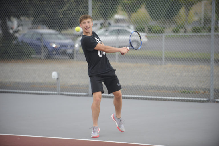 Wayne Havrelly/Post Record 
 Nathan Louck goes after a tough shot at the Camas High School tennis facility.