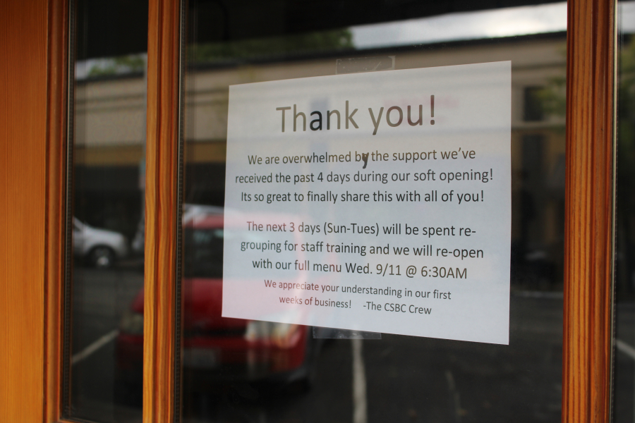 A sign posted earlier this week in the front door of the new Cedar Street Bagel Company in downtown Camas speaks to the community support during the shop's soft opening earlier this month.