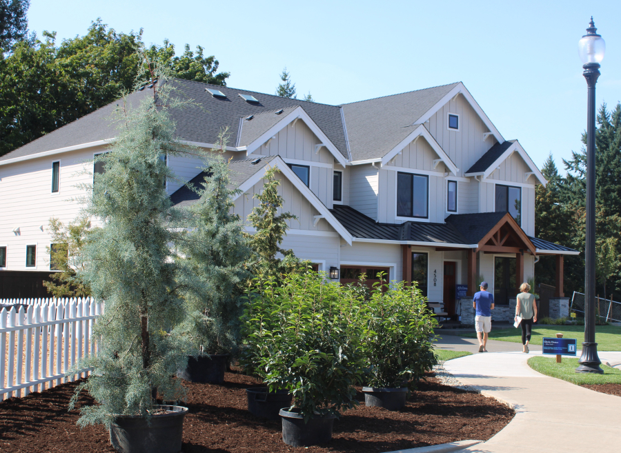 Visitors walk toward the "Mira Verde" home by Glavin Homes during the first day of the 2019 NW Natural Parade of Homes at Dawson's Ridge in Camas, on the home tour's opening day, Friday, Sept. 6. (Photos by Kelly Moyer/Post-Record)