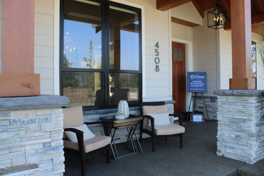 The front porch of the "Mira Verde," a 4,421-square-foot, five-bedroom, modern farm style home with timber-frame accents, an outdoor living space and full guest bedroom suite with private bathroom by Glavin Homes, welcomes visitors to the 2019 Parade of Homes in Camas' Dawson's Ridge community.