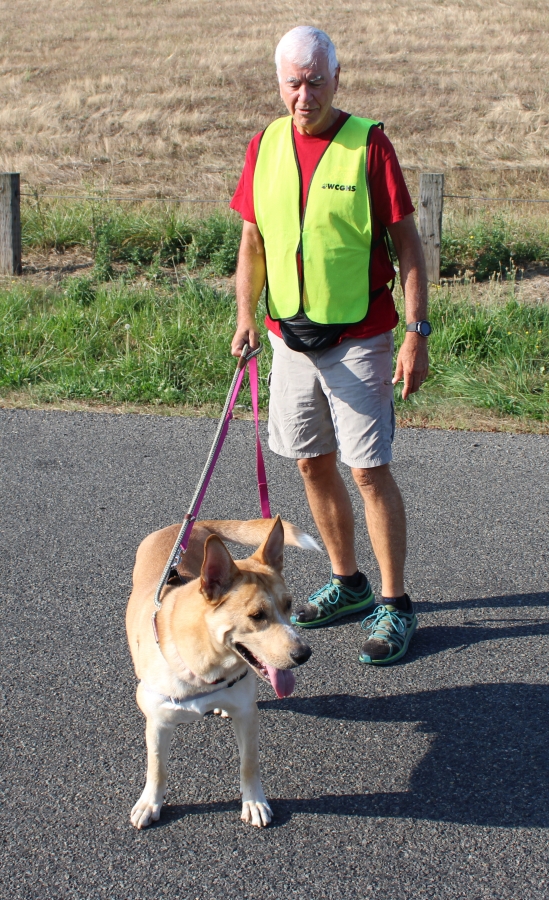 Camas resident Fred Parrish walks along Index Road in Washougal with Loki, a shepherd-husky mix, on Sept. 6.