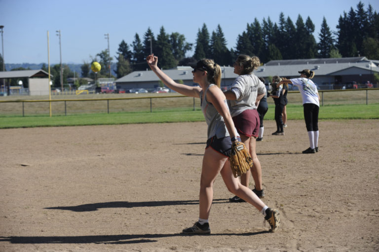 The Washougal High School slowpitch softball team works out during a recent practice session.