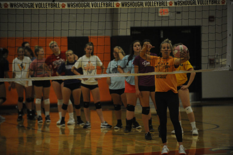 Washougal High School junior Sierra Musick dives for a dig during practice session.