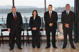 The four finalists for the city of Washougal's chief of police position, from left to right, Steve Taylor, Wendi Steinbronn, Marc Denney and Charles Goeken stand while being introduced at a reception Sept. 17 at the Black Pearl on the Columbia in Washougal. 