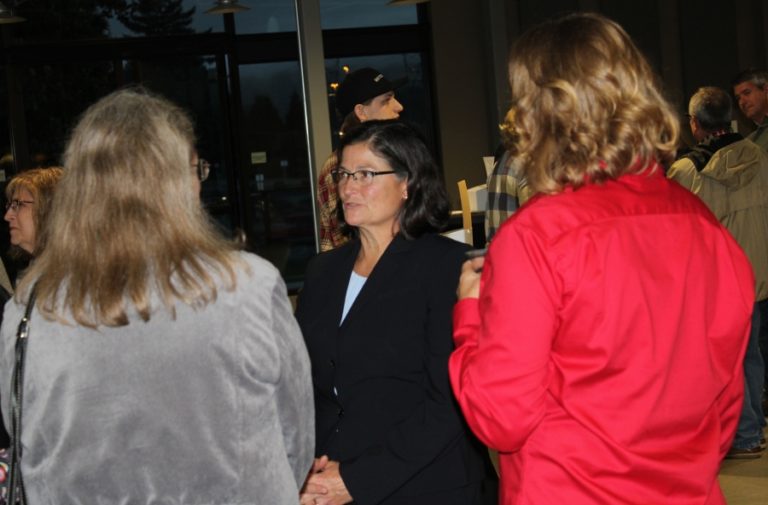 Wendi Steinbronn (middle), one of four finalists for the city of Washougal&#039;s police chief position, talks with attendees at a reception Sept. 17 at the Black Pearl on the Columbia in Washougal.