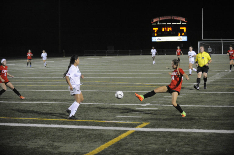 Camas High School sophomore Kiya Gramps scores a goal after shaking off a defender during the Papermakers&#039; 7-0 victory over Reynolds (Ore.) High School on Sept. 12.
