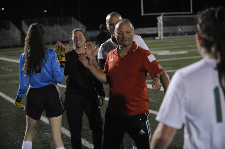 Less than a year after retiring from coaching, Roland Minder (red shirt) is back on the sidelines as an assistant to new Camas High School girls soccer head coach Keri Tomasetti (black shirt), who was Minder&#039;s assistant for the past 13 seasons.