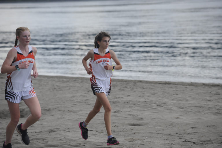 Washougal High School ophomore Savea Mansfield (left) and freshman Sidney Boothby lead all runners in the Panthers&#039; first home race of the season at Captain William Clark Park on Sept. 18.