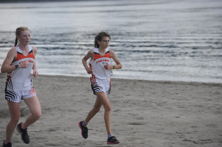 Washougal High School ophomore Savea Mansfield (left) and freshman Sidney Boothby lead all runners in the Panthers&#039; first home race of the season at Captain William Clark Park on Sept. 18.
