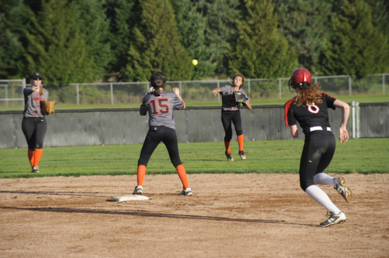 Camas High School slowpitch softball player Grace Curley prepares to slide into second base during the Papermakers&#039; home game Sept. 25 against Washougal.