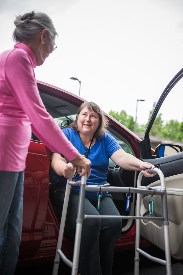 A volunteer from a Villages NW-affiliated nonprofit in Portland helps a Villages member with transportation.