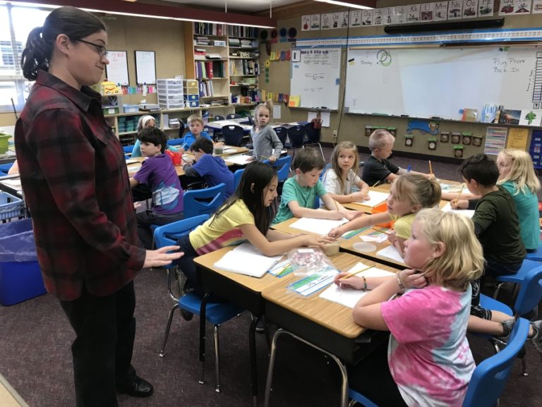 Mount Pleasant School second/third-grade teacher Cara Ramsey helps students Ole Stiles, McKinley Williams, Lilly Blaisdell and Audrey Morales with a science project Monday, Oct.