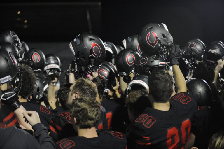 The Camas High School football team celebrates after a dominating performance against Heritage High School on Friday, Oct. 4.