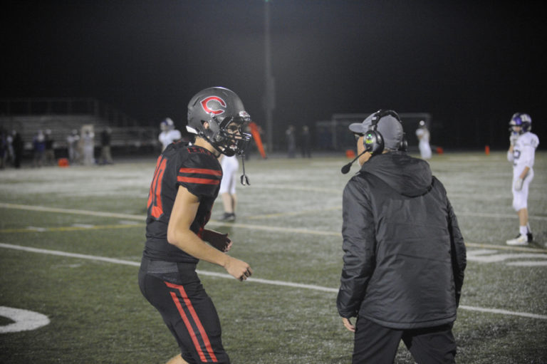 Wayne Havrelly/Post-Record 
 Camas High School kicker and punter Bryce Leighton gets direction from Papermakers coach Jon Eagle during the team&#039;s homecoming game against Heritage High School on Friday, Oct. 4.  Leighton is currently ranked as the No. 2 punter in the the country and will represent CHS in the Under Armour All-America Game, to be held in Orlando, Fla., on Jan. 2.