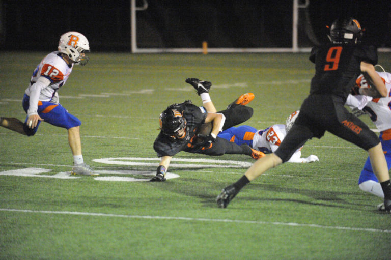 Washougal High School&#039;s Brevan Bea catches a pass late in the first half of the Panthers&#039; Oct. 4 game against Ridgefield High School. After the play he left the game with a rib injury.