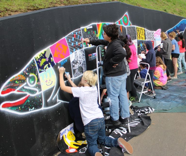 Doug Flanagan/Post-Record 
 Jemtegaard Middle School Club 8 art students paint a mural of a Chinook salmon in Washogual on Saturday, Oct. 12.