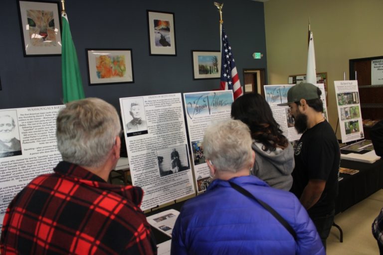 &quot;White Wing&quot; mural ceremony attendees look at exhibits featuring the life of Washougal founder Betsey Ough at the Washougal Community Center on Wednesday, Oct. 9.