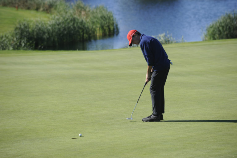Camas High School golfer Owen Huntington drains a 10-foot putt at Tri-Mountain Golf Course in Ridgefield on Oct. 10.