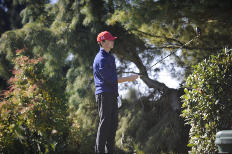 Camas HighSchool golfer Owen Huntington sizes up a shot at the 4A District 4 tournament on Oct. 10.