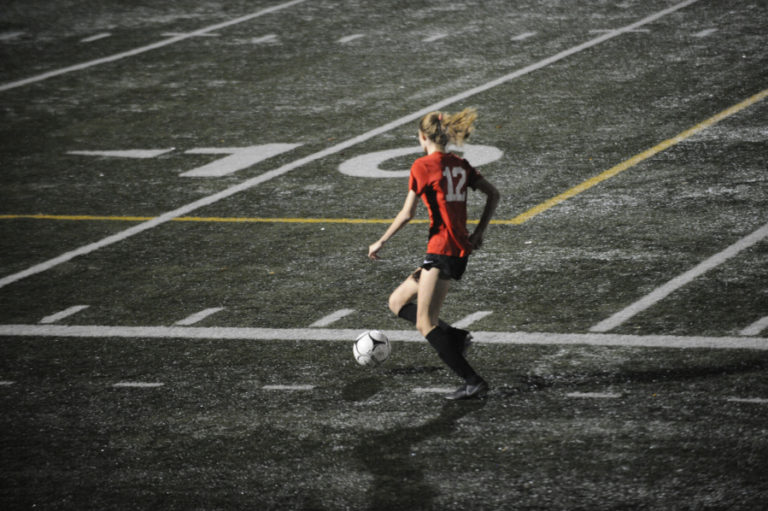 Camas High School junior Paige Nelson controls the ball on a fast break against Heritage High School on Oct. 17.