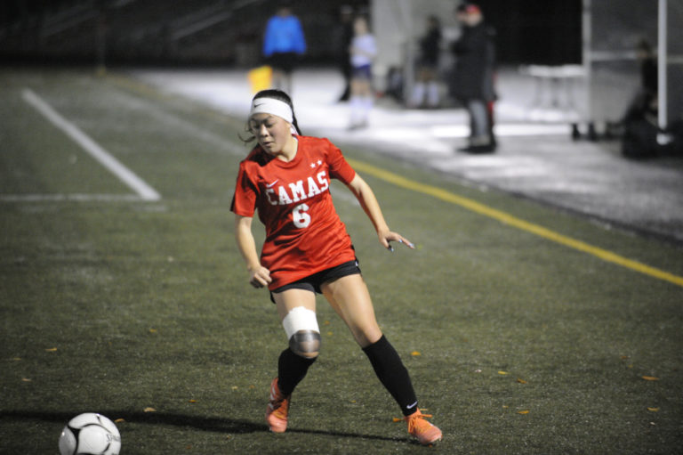 Camas High School (CHS) junior forward Jasmine Whittington controls the Papermakers&#039; offense near the goal during an Oct. 17 game against Heritage High School. Whittington, who leads CHS in scoring, left the game late in the second half with a knee injury.