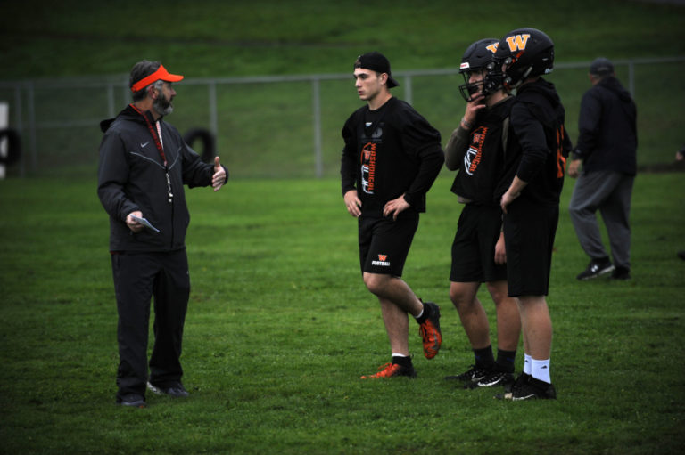 Washougal High School football coach Dave Hajek (right) gives words of wisdom to some of his skill players during a practice session on Monday, Oct. 21. &quot;I think we are just as talented as Hockinson, and I think if we execute we can pull this game off,&quot; he said about his team&#039;s Oct.