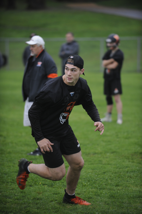 Washougal High School senior Brevan Bea works on his route running during a practice session on Monday, Oct. 21.