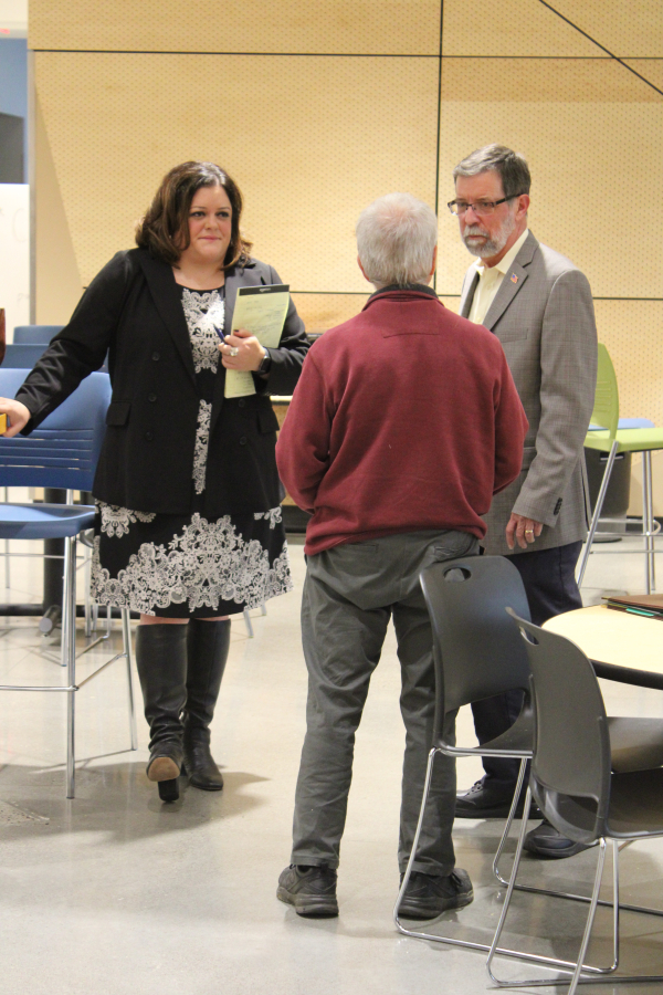 Camas City Council members Deanna Rusch (left) and Greg Anderson (right) speak to constituents at the Youth Advisory Council&#039;s 17th annual candidate forum, held Oct.