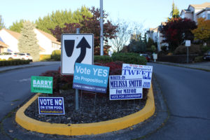 "Vote No" and "Vote Yes" signs related to the city of Camas' proposed $78 community-aquatics center bond mingle with candidate signs throughout Camas.