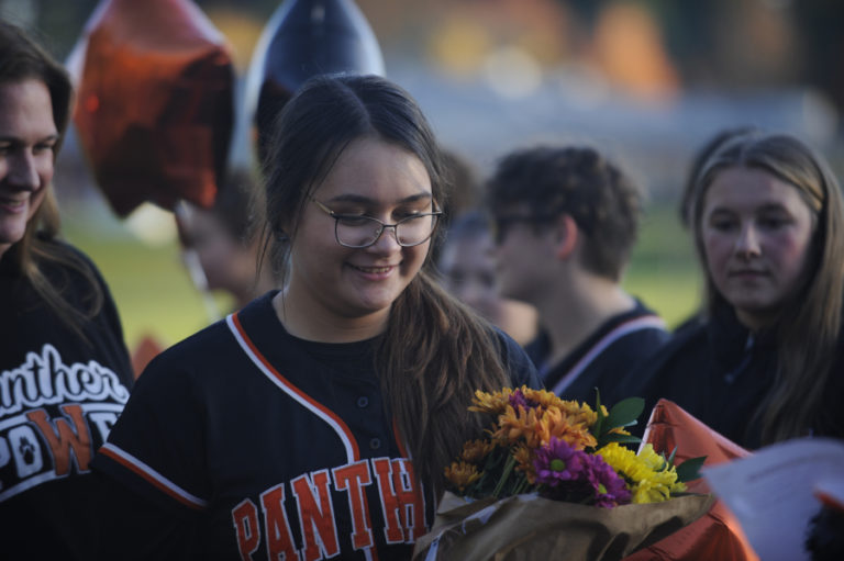 Washougal High School slowpitch softall coach John Carver gives his team some motivation during the Panthers&#039; District 4 tournament game against Mark Morris High School.