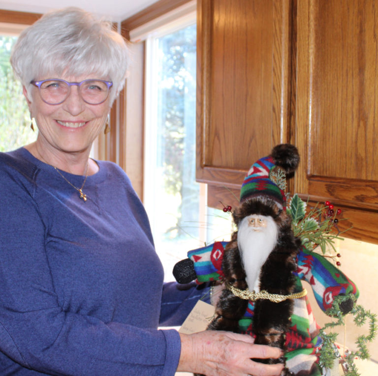 Kelly Moyer/Post-Record
Sandy Havrelly, of Washougal, shows the sunny space in her kitchen where she crafts her Santa figurines. Dressed in fabric that often includes Pendleton wool and fur (pictured) with realistic, hand-sculpted faces, &quot;Sandy&#039;s Santas&quot; are a big hit at the annual Washougal United Methodist Church Holiday Bazaar. (Kelly Moyer/Post-Record)