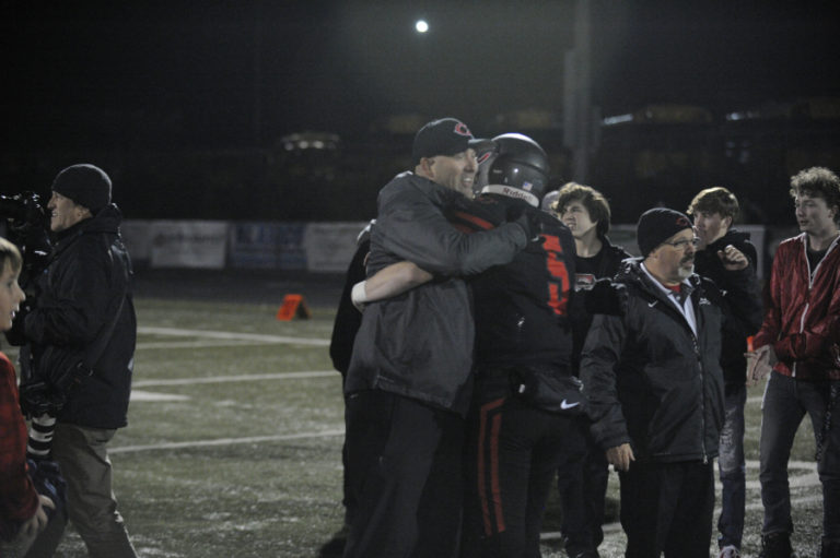 Camas High School senior quarterback Blake Ascuitto receives hugs after the Papermakers&#039; 28-14 win over Union High School on Nov. 1. Ascuitto started for the first time this season after Jake Blair suffered a broken collarbone in an Oct. 24 game against Skyview High School.
