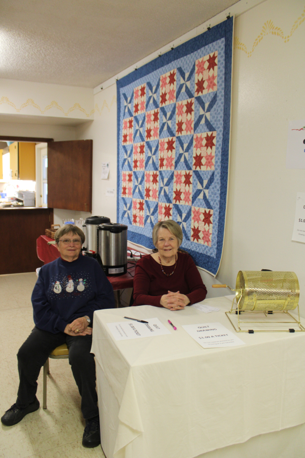 Linda Jacobs (left) and Louann Wittler (right) sell $1 raffle tickets for the handmade quilt pictured behind them at the Washougal United Methodist Church Holiday Bazaar on Saturday, Nov. 9. Look for more local holiday bazaar listings, see the classified advertisements in today's Post-Record.