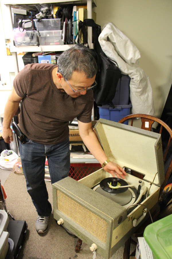 Kelly Moyer/Post-Record 
 Pat Kagi puts a record on a 1950s record player he recently repaired inside the ReTails Thrift Store in Vancouver on Friday, Nov. 8.
