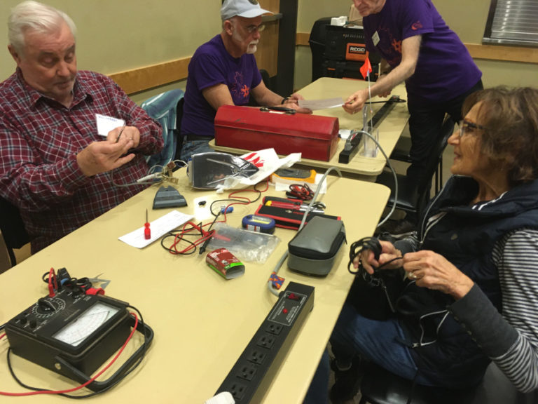 Contributed photo courtesy of Repair Clark County and Columbia Springs 
 Volunteers help residents diagnose and repair broken household items at a Battle Ground Repair Clark County event in early November. 
 The repair group will host a Camas event from noon to 2 p.m., Saturday, Nov. 16, at the Camas library, 625 N.E. Fourth Ave., in downtown Camas. 
 Members of the public can bring knives and other blades in need of sharpening, sewing projects, broken jewelry, bicycles in need of repair and antique or modern household appliances and electronics. Volunteers will diagnose the repair problem and attempt to repair the items during the event.