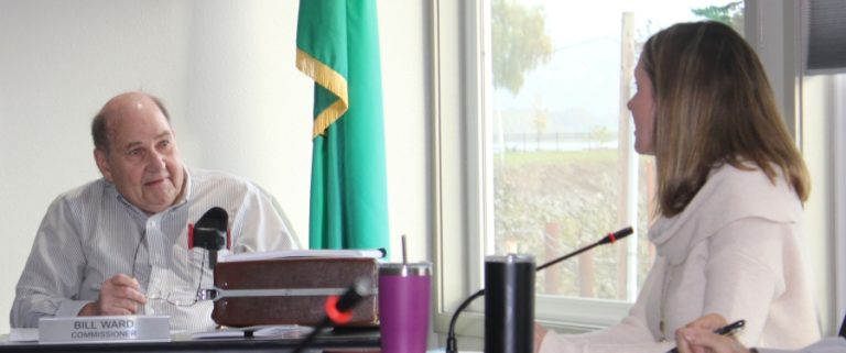 Port of Camas-Washougal Commissioner Bill Ward (left) talks with Kim Noah, the Port&#039;s director of operations, at an Oct. 22 Port meeting in Washougal.