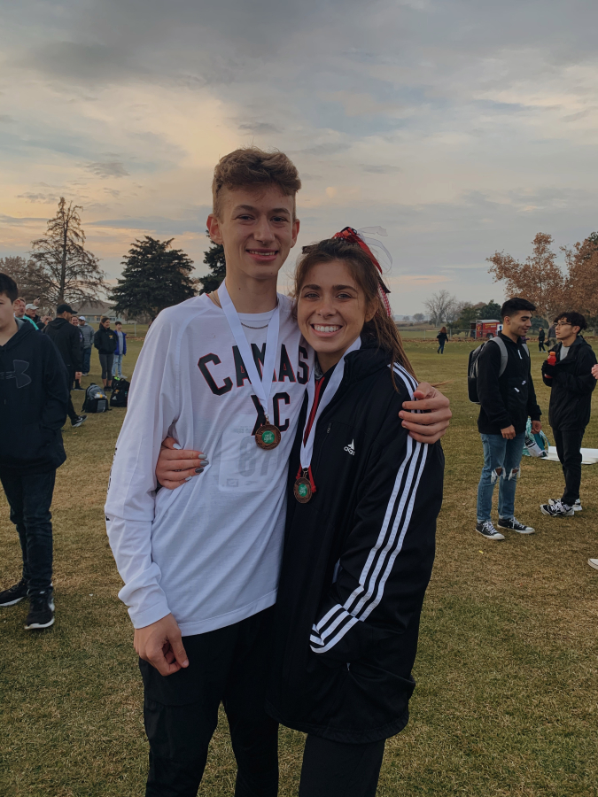 Siblings Evan and Halle Jenkins celebrate after being the top finishers for Camas High School at the 4A state cross country championships in Pasco on Nov.