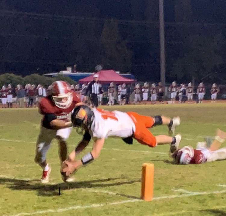 Washougal High School quarterback Dalton Payne dives for a touchdown during the Panthers&#039; 28-7 victory over W.F. West on Nov. 8.