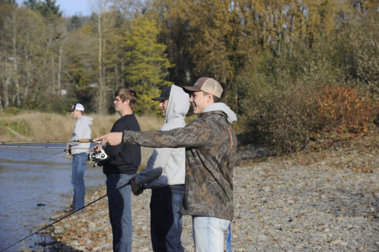 From right to left, Washougal High School football players Brevan Bea, Julien Jones, Jakob Davis and Dalton Payne fish along the Washougal River on Nov. 11.