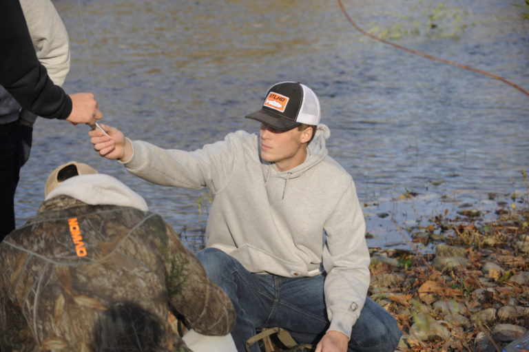 Washougal Higgh School quarterback Dalton Payne, who calls the plays on the field, makes a call on lures during a pre-practice fishing trip on Nov. 11.