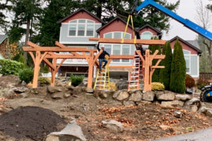 Workers from New Energy Works construct a timber frame for a solar canopy outside Randy Friedman and Debbie Nagano's Camas home on Monday, Nov. 18. (Contributed photo courtesy of Randy Friedman)