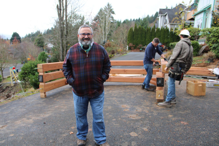 Randy Friedman stands near the solar canopy being constructed in the front yard of his Camas home on Monday, Nov. 18.