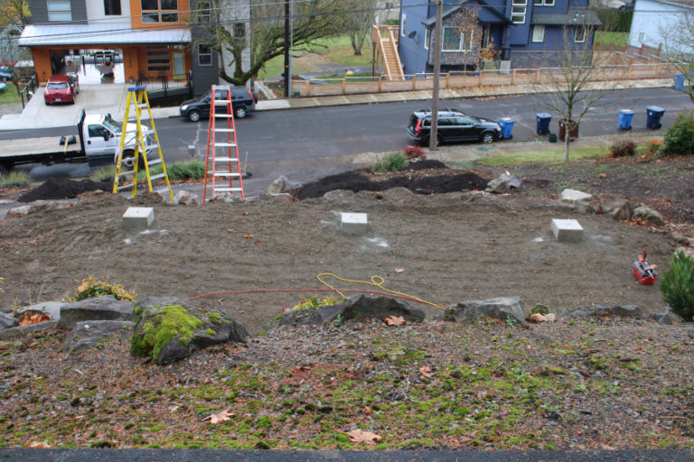 Concrete pads in the front yard of Randy Friedman and Debbie Nagano's Camas home will provide support for the couple's solar canopy, a solar-power structure that combines function with beauty and will power the couple's electric vehicle.