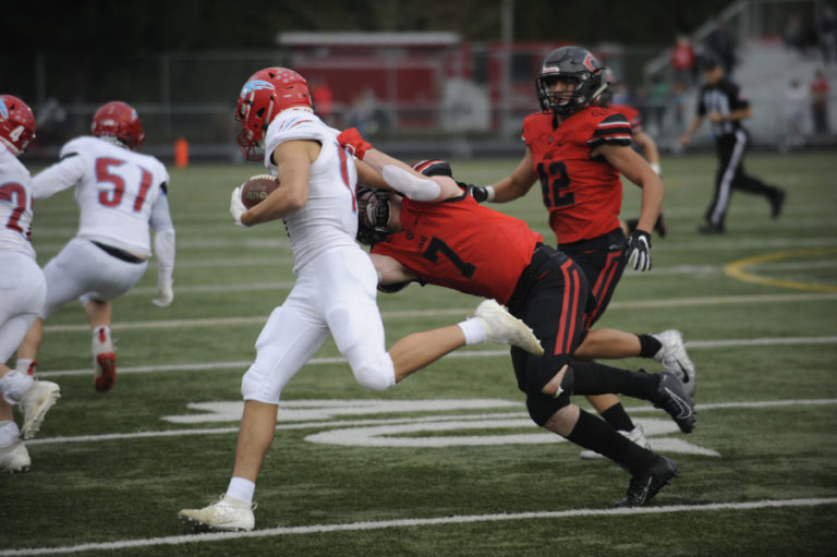 Camas High School senior Tyler Forner sacks a scrambling Eastmont High School quarterback on Nov. 16. Forner returned to action after missing one game because of an injury.