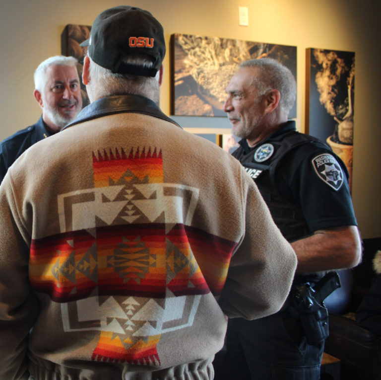 Washougal resident Bob Maddox (center) talks to Camas Police Chief Mitch Lackey (left) and Washougal Police Chief Ron Mitchell (right) during the Nov. 22, 2019 "Coffee with a Cop" event at the Washougal Starbucks.