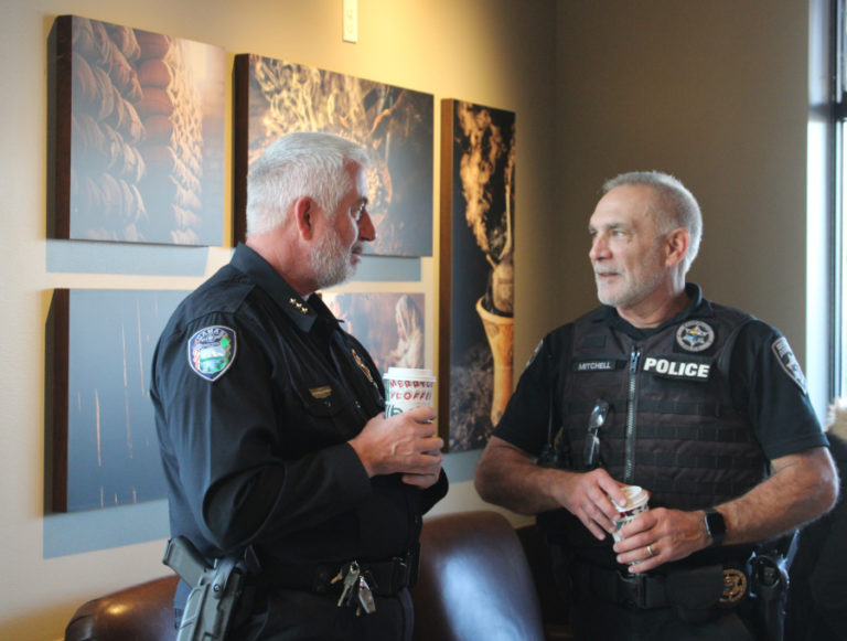 Camas and Washougal&#039;s police chiefs, Mitch Lackey (left) and Ron Mitchell (right) catch up during the Nov.
